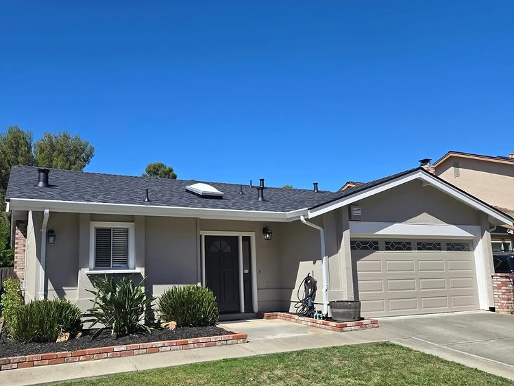 Bay Area home with a new Oates Roofing shingle roof under a clear blue sky